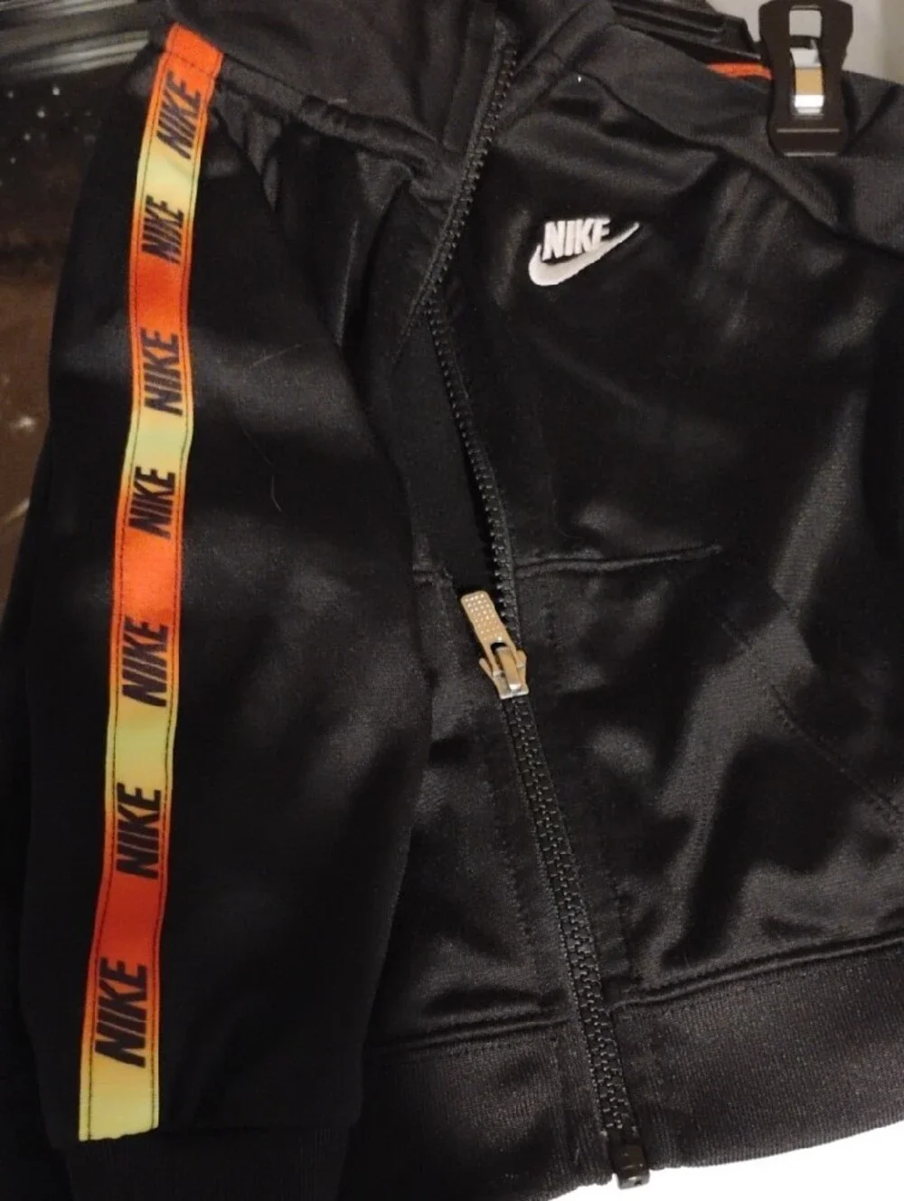 Nike Black Kids Track Jacket with Orange and Yellow Stripe